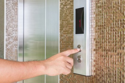 Man Pressing Elevator Button